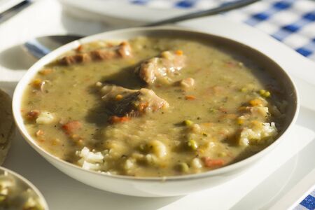 Savory sauce from vegetable with meat and rice is in white plate.の写真素材