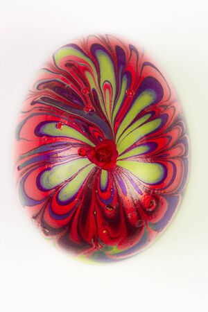 Colorful decorated Easter egg is on white background.の写真素材