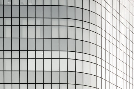 Windows of offices on skyscraper, geometric lines, architecture detail.の写真素材