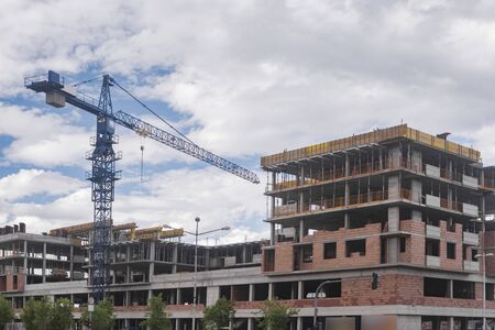 Crane machinery and construction of building, architecture concept. 