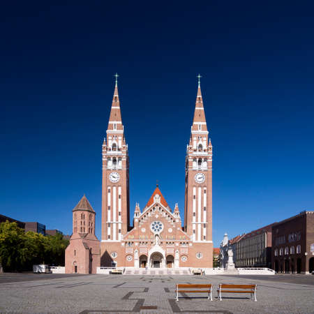 The beautiful church building with two towers in neoroman architectural style is on the Dom square in Szeged town in Hungary.のeditorial素材