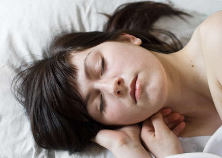 Young sleeping womanの写真素材