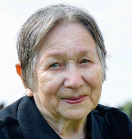 Smiling senior woman outdoorの写真素材
