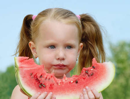 Baby girl eating watermelonの写真素材