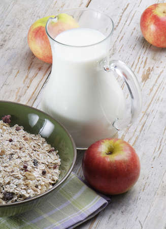 Healthy breakfast - muesli, milk and applesの写真素材