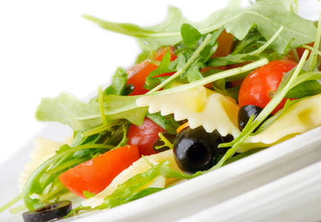 Pasta salad isolated on whiteの写真素材