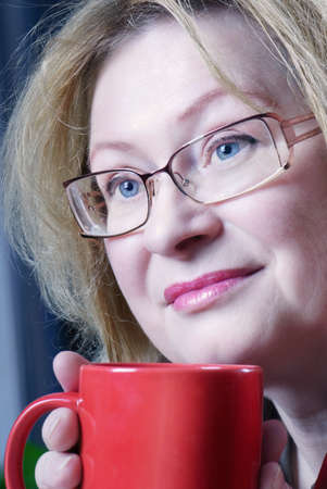 Woman with tea cupの写真素材
