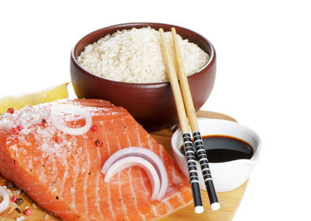 Asian cousine - rice,salmon and soy sauce isolated on white backgroundの写真素材