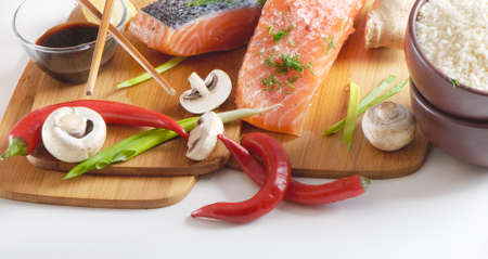 salmon steak with rice, vegetables and soy sauceの写真素材