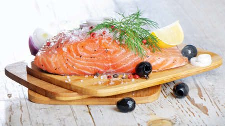 Fresh salmon steak with lemon の写真素材
