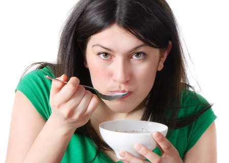 Beautiful young woman having healthy breakfastの写真素材
