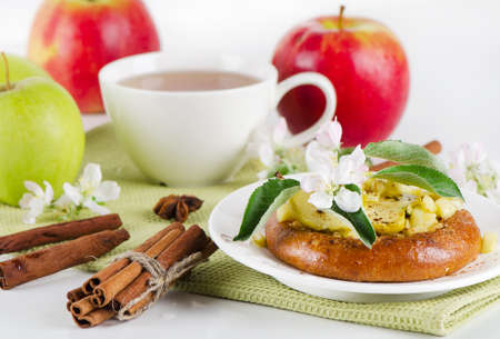 Apple cakes with  tea cupの写真素材