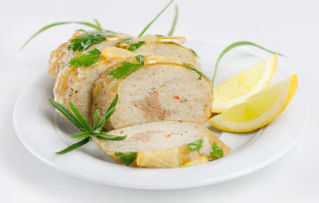 stuffed fish with  on white plateの写真素材