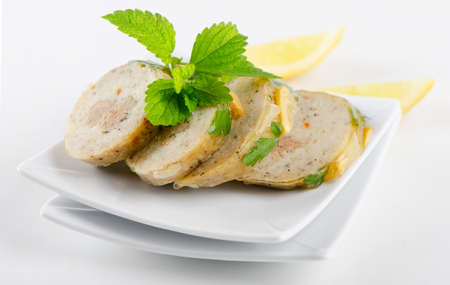 stuffed fish with  on white plateの写真素材