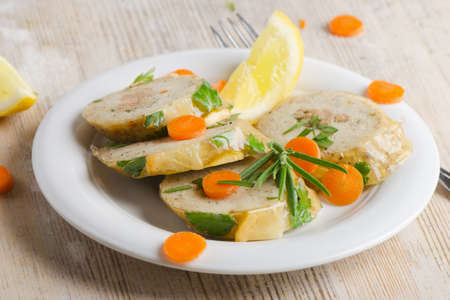 stuffed fish with  on white plateの写真素材