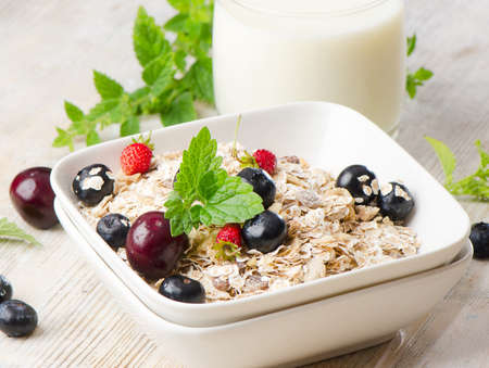 Healthy breakfast - muesli, milk and berryの写真素材