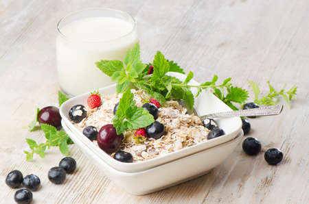 Healthy breakfast - muesli, milk and berryの写真素材