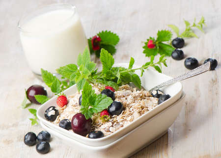 Healthy breakfast - muesli, milk and berryの写真素材