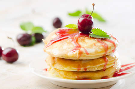 pancakes with cherriesの写真素材
