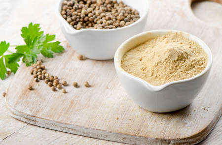coriander on a wooden tableの写真素材
