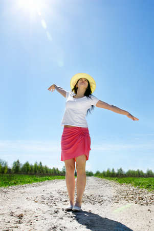 Young happy woman outdoors in summerの写真素材