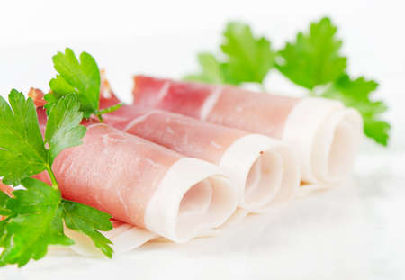 Slices of bacon and herbsの写真素材