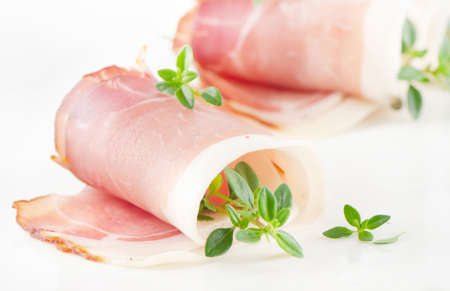 Slices of bacon and herbsの写真素材