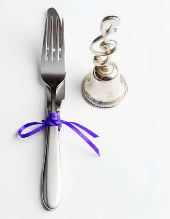Knife and fork on a white