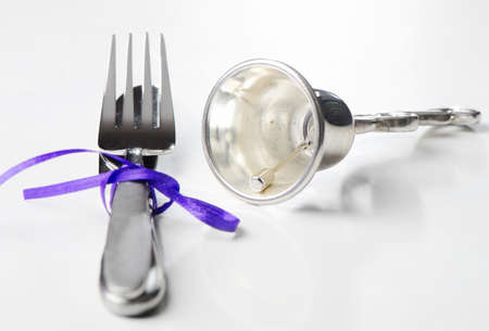 Knife and fork on a whiteの写真素材