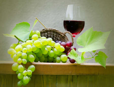 red wine with grapesの写真素材