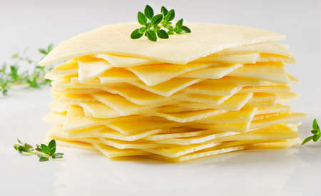  Cheese slices with fresh herbsの写真素材