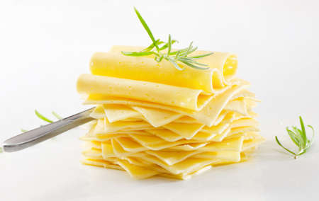 Cheese slices with fresh herbsの写真素材
