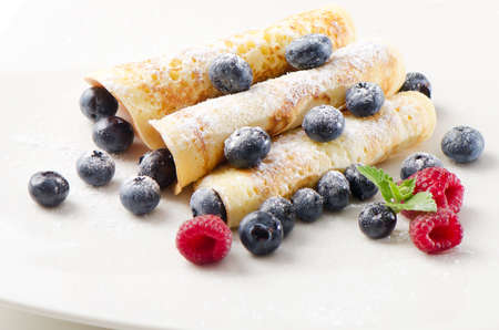 pancakes with raspberries and blueberiesの写真素材