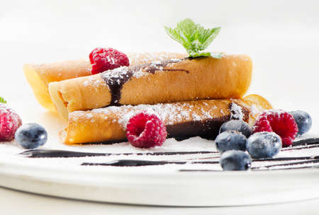 pancakes with raspberries and blueberiesの写真素材