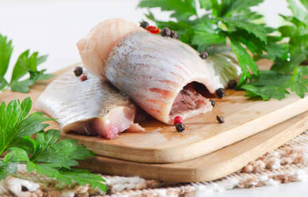 Herring on a wooden tableの写真素材