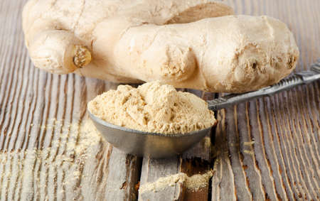 Ginger on a wooden tableの写真素材