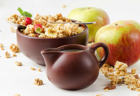 Healthy breakfast - muesli and fresh applesの写真素材