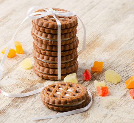 stack of cookies and dried fruits on a wooden tableの写真素材