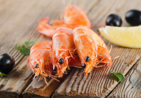 tiger shrimps on  wooden tableの写真素材