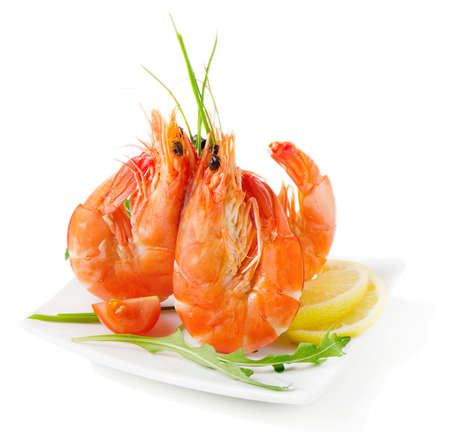 Tiger shrimps with fresh vegetables isolated on whiteの写真素材