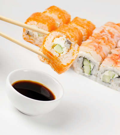 sushi on chopstickの写真素材