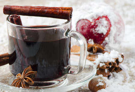 mulled wine and red apple   on  wooden tableの写真素材