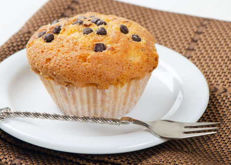Delicious  sweet  muffin on white plateの写真素材