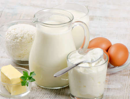 Dairy products on  wooden tableの写真素材