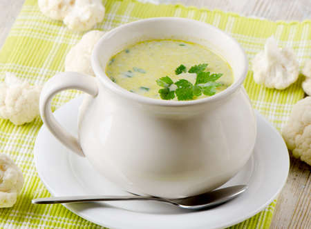 Creamy vegetables soup and cauliflowersの写真素材