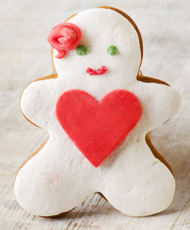 Homemade gingerbread man  on a wooden tableの写真素材
