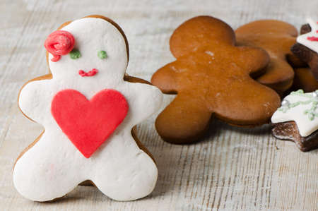 Homemade gingerbread man  on a wooden tableの写真素材