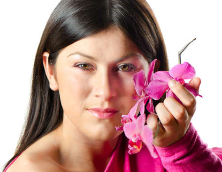 young beautiful woman with  orchid isolated on whiteの写真素材
