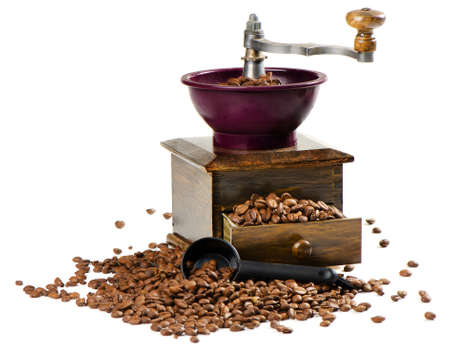 Coffee and old-fashioned coffee grinder isolated on whiteの写真素材