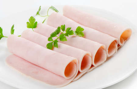 Slices of ham and herbs